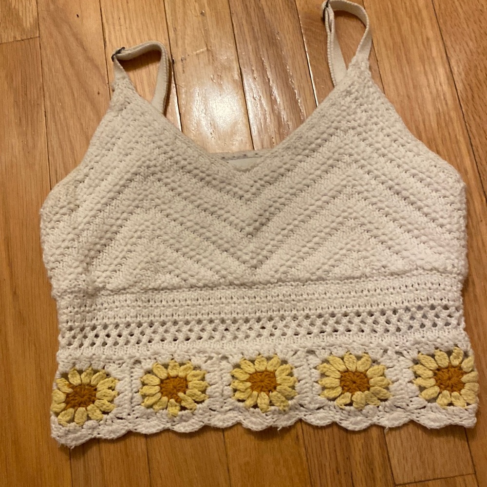 Crochet tank with sunflower detail.